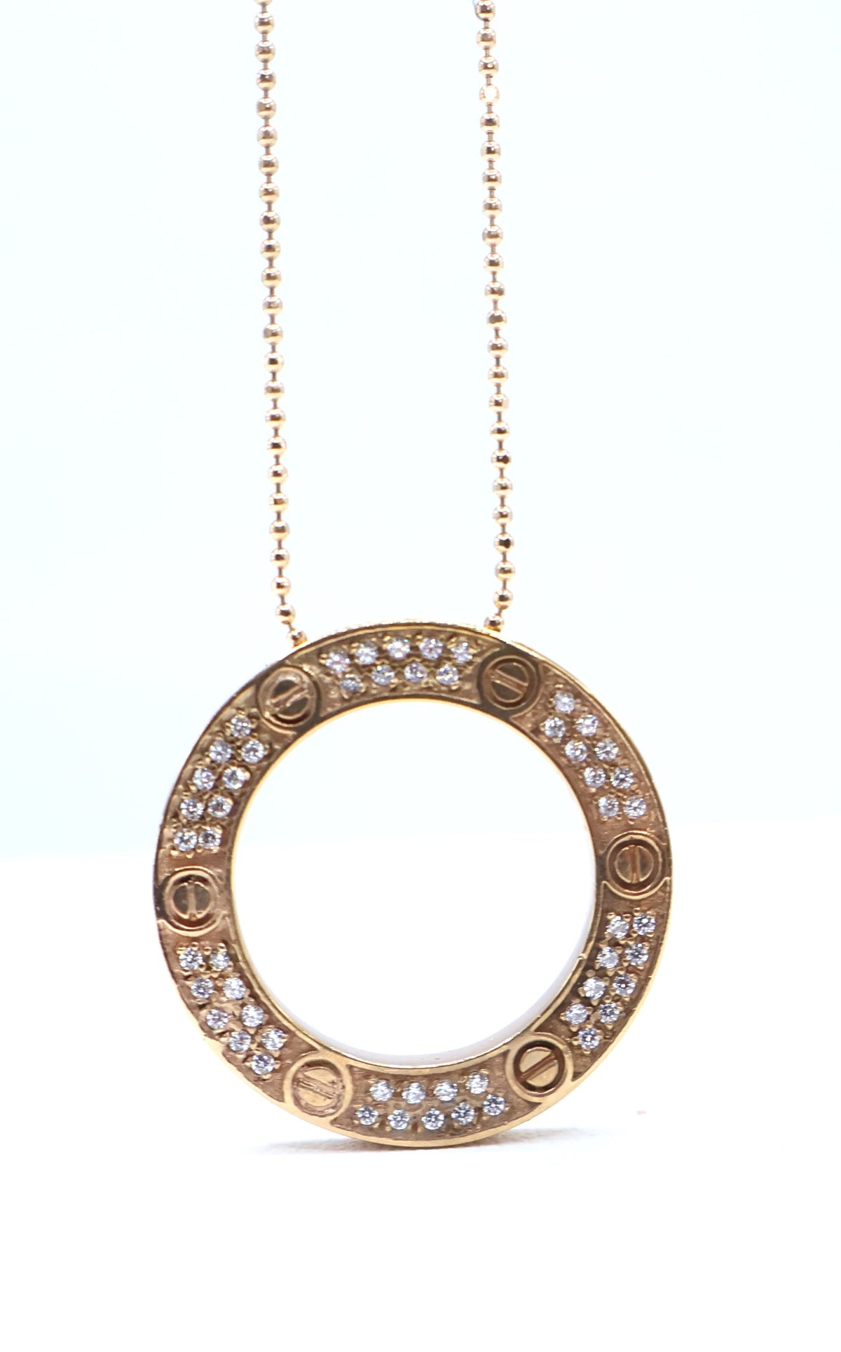 CADENA CON DIJE CIRCULAR ORO ROSA 18K